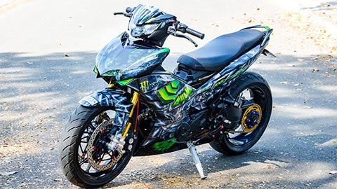 A picture containing motorcycle, outdoor, ground, parkedDescription automatically generated